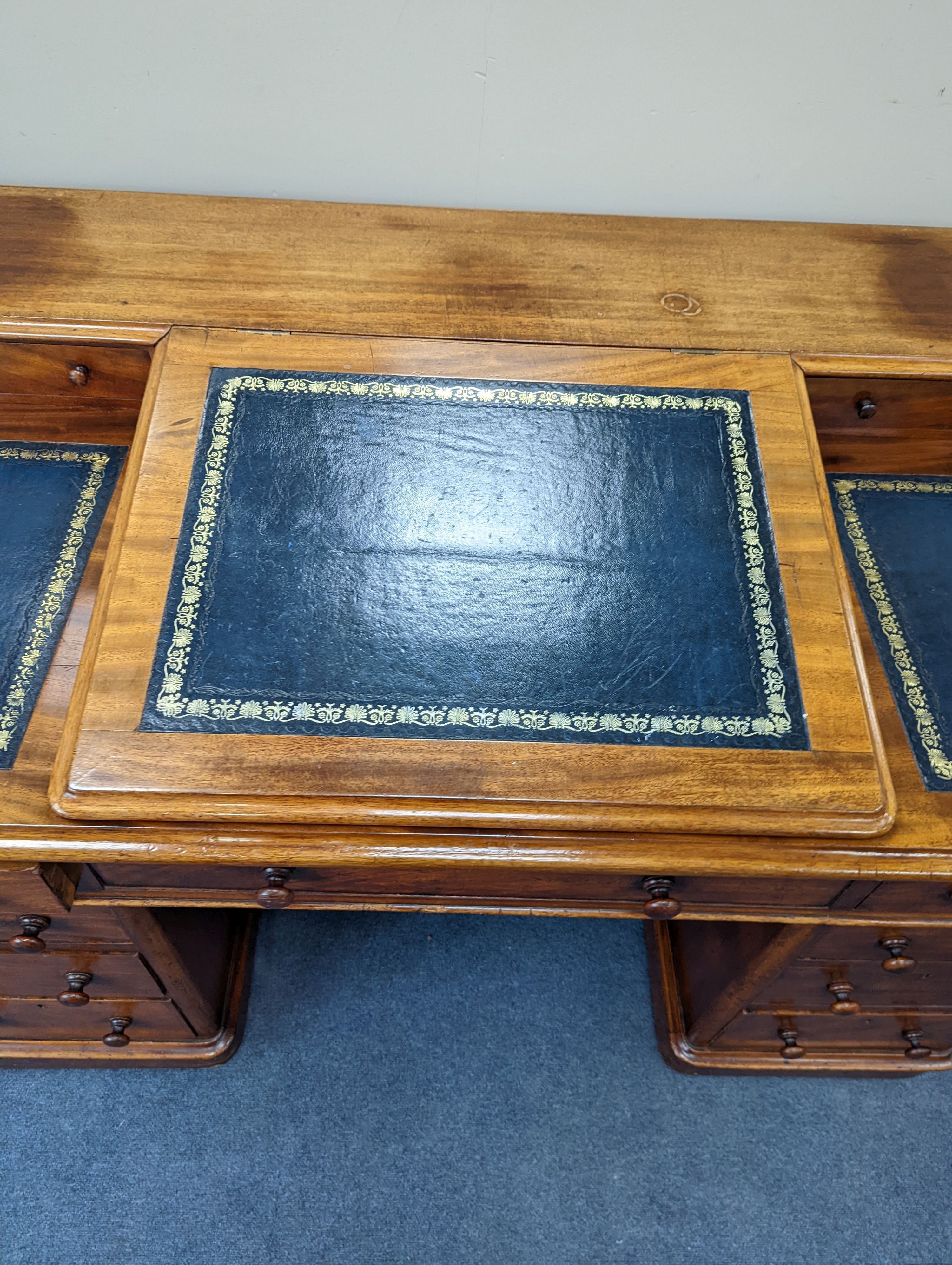 A Victorian ‘Dickens’ mahogany pedestal desk, width 137cm, height 87cm